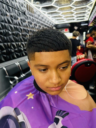 Kid with a short classic cut, no fade