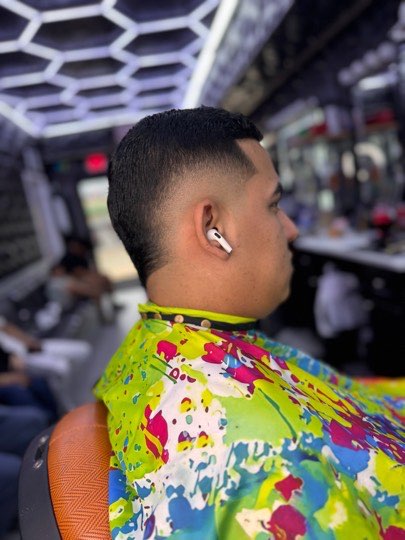 Finished fade haircut with a straight line up on the neck