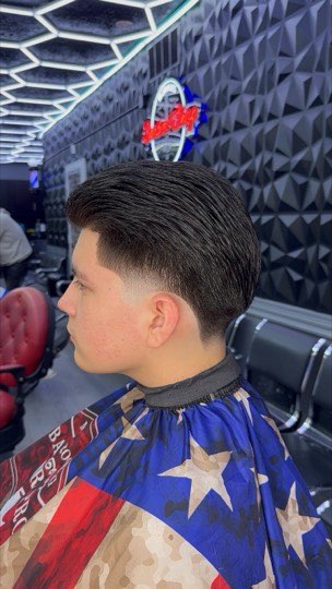 Taper with the top slicked back and a clean line up.