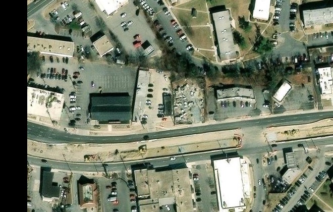 Aerial view of 2080 University Boulevard East in Hyattsville, the plaza where Morales Barbershop MB is, with its parking lot